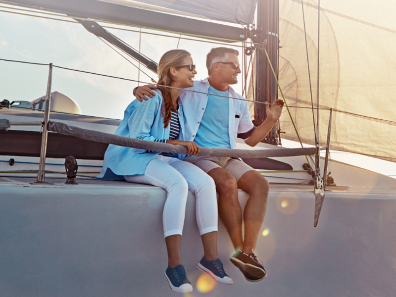 Photo: Man and woman enjoying life on a boat