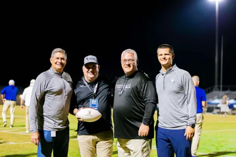Photo: Dr. Chad Mitchell Honored for 25 Years of Sideline Support to Bay District Schools