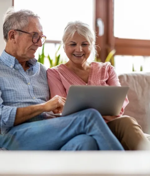 older couple reading their tablet